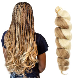 Person with long braided hair and a bundle of blonde hair extensions.