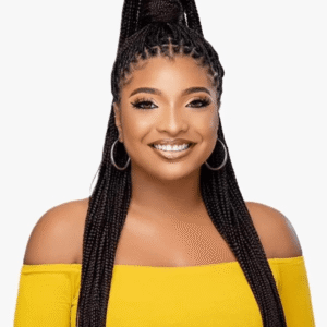 Woman with sleek box braids styled in a high ponytail, wearing a yellow off-shoulder top and smiling.